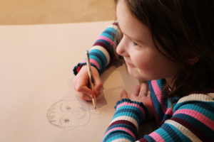 Picture of young girl drawing a picture